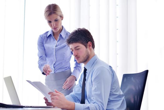 Group of happy young  business people in a meeting at office