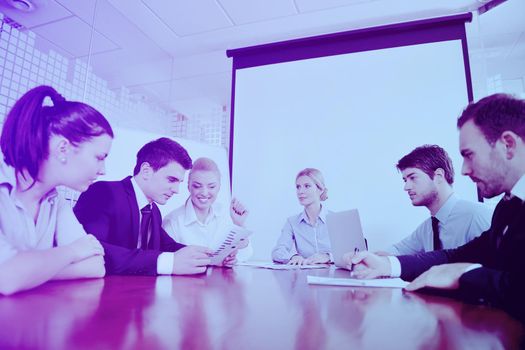 Group of happy young  business people in a meeting at office