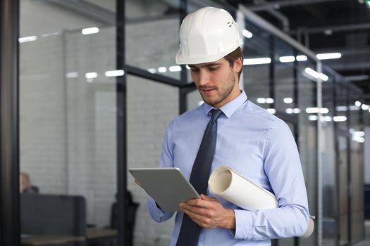 Shot of a engineer using a digital tablet on a construction site