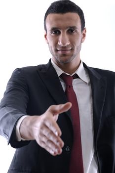 Confident business man giving you a hand shake on white background representing concept of success and cooperation