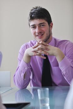 young business man lawyer with laptop alone in big bright   conference room