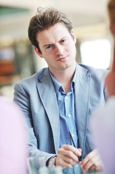 young business man lawyer with laptop alone in big bright   conference room