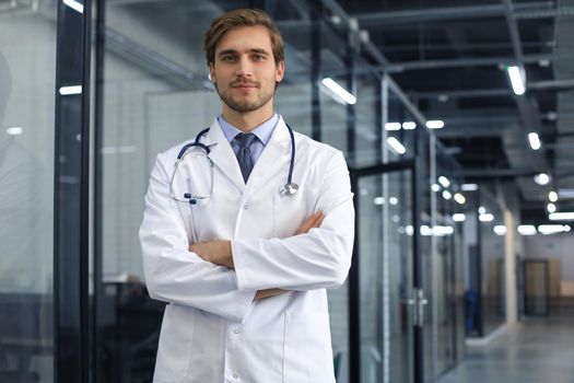 Portrait of young male doctor with stethoscope, close up
