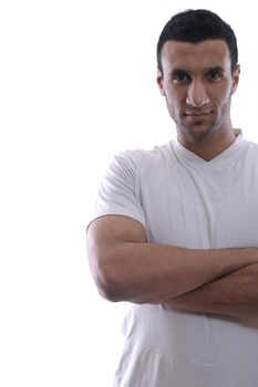 portrait of relaxed young man dressed in white shirt and jeans isolated over white background in studio