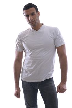 portrait of relaxed young man dressed in white shirt and jeans isolated over white background in studio