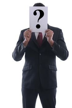 Business man holding a piece of paper over his face with a question mark on it isolated on white background in studio