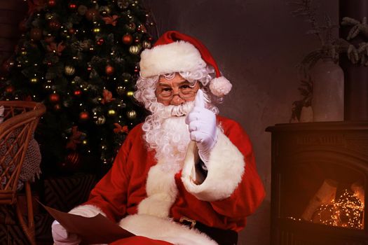 Santa Claus standing with thumbs up. Home decoration