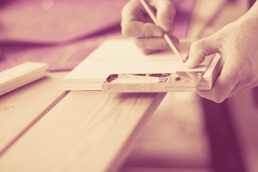 Architect working on drawing table in office.
