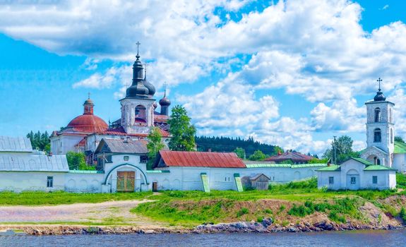 Beautiful view from the Volga river to the ancient Russian monastery. Sunny, fine day, blue sky and cumulus clouds. Concept history of Russia, tourism.