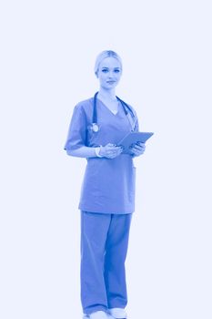 Female doctor using a digital tablet and standing on white background. Woman doctors