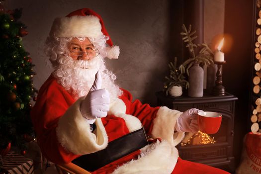 Santa Claus standing with thumbs up. Home decoration
