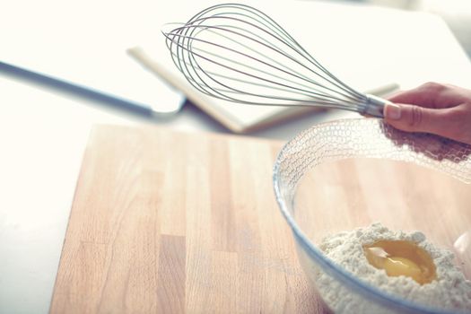 Woman making christmas cookies in the kitchen.