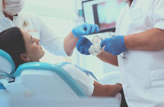 Dentist and his assistant carrying out a thorough examination.