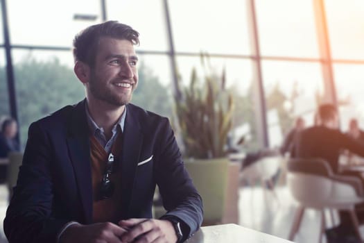 business man portrait at modern open space office indoors