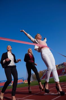 business people running together on  athletics racing track