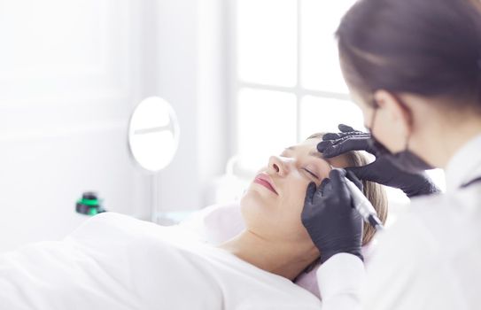 Microblading eyebrows work flow in a beauty salon