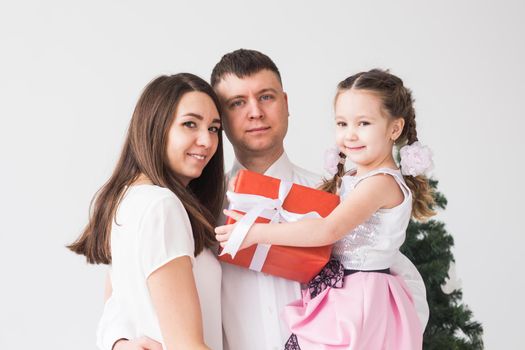 Children, festive and holidays concept - Christmas family portrait in home holiday living room.