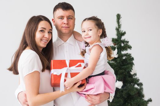 Children, festive and holidays concept - Christmas family portrait in home holiday living room.