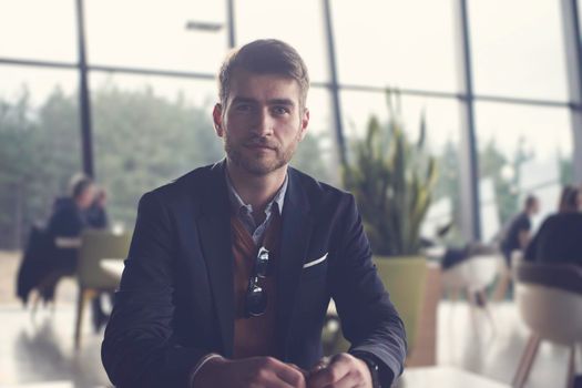 business man portrait at modern open space office indoors