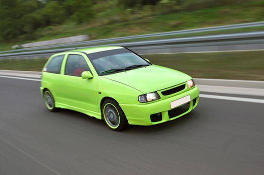 Fast tuming car riding down the highway