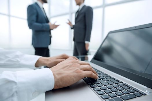 close up.businessman typing on a laptop.people and technology