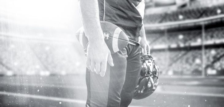 Closeup Portrait of a strong muscular American Football Player on big modern stadium field with lights and flares