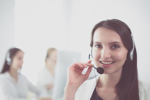 Attractive business woman working on laptop at office. Business people.