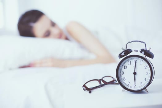 Young beautiful woman lying in bed