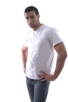 portrait of relaxed young man dressed in white shirt and jeans isolated over white background in studio