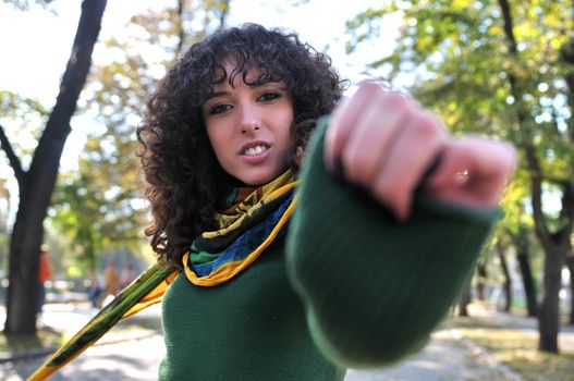 brunette Cute young woman with colorful scarf posing outdoors in nature