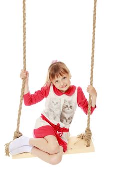 Beautiful little girl swinging on swing. The concept of family happiness, child development, sports education and summer recreation. Isolated on white.