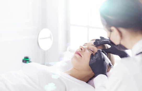 Microblading eyebrows work flow in a beauty salon