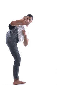 portrait of relaxed young man dressed in white shirt and jeans isolated over white background in studio