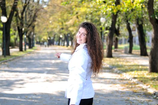 brunette Cute young woman smiling outdoors in nature