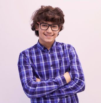 portrait  of smart looking arab teenager with glasses wearing a hat in casual school look isolated on white copy space