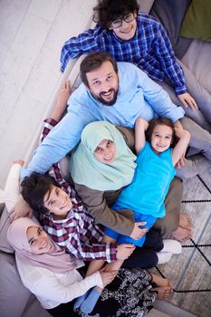 muslim family portrait with arab  teenage kids at modern home interior top view