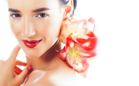 young pretty brunette real woman with red flower amaryllis isolated on white background