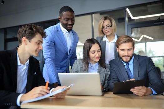 Business meeting - manager discussing work with his colleagues