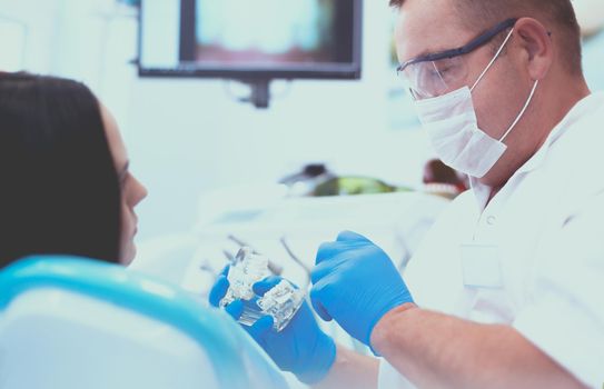 Dentist and his assistant carrying out a thorough examination.