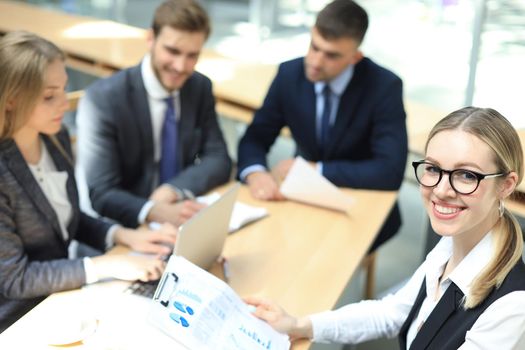 Top view of business people working together while spending time in the office