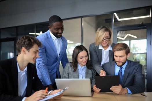 Group of business people in a meeting discussing and planning a project.