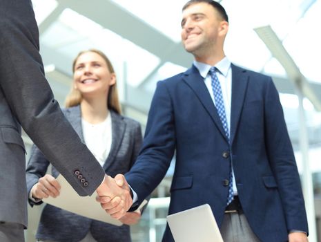 Business people shaking hands, finishing up a meeting