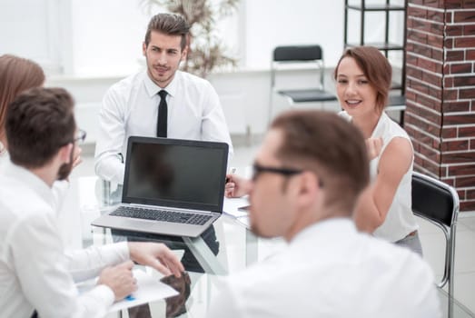 business team holds a meeting in a bright office.the concept of teamwork