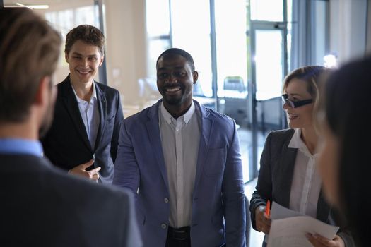 happy young businessman shaking hands with his business partner.