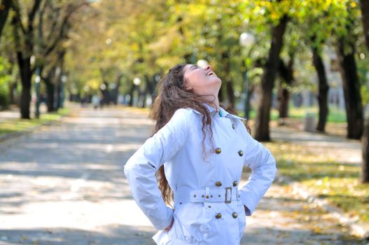 brunette Cute young woman smiling outdoors in nature