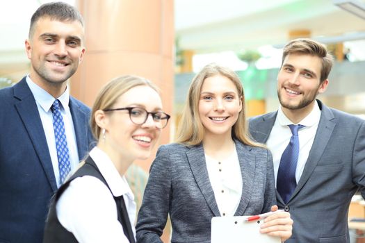 group of successful business people on the background of the office