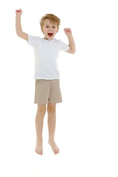 Joyful little boy fun jumping and waving his arms. Dressed in a pure white T-shirt on which you can draw or write any advertising text. Isolated on white background.