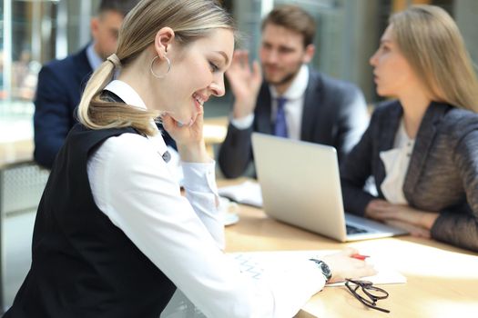 business woman with her staff, people group in background at modern bright office indoors