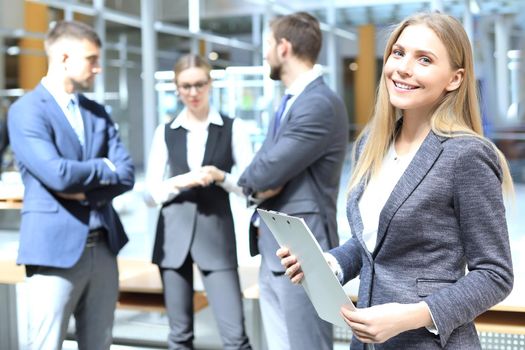 Face of beautiful woman on the background of business people