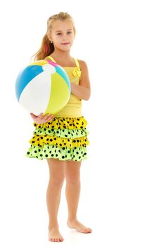 A good girl is playing with a big inflatable ball. The concept of a happy childhood, recreation in nature, exercise. Isolated on white background.